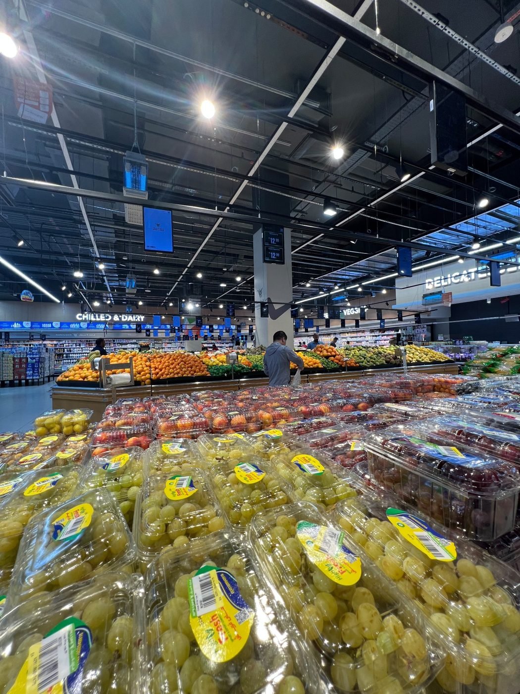 Fresh fruits and vegetables displayed in a produce market